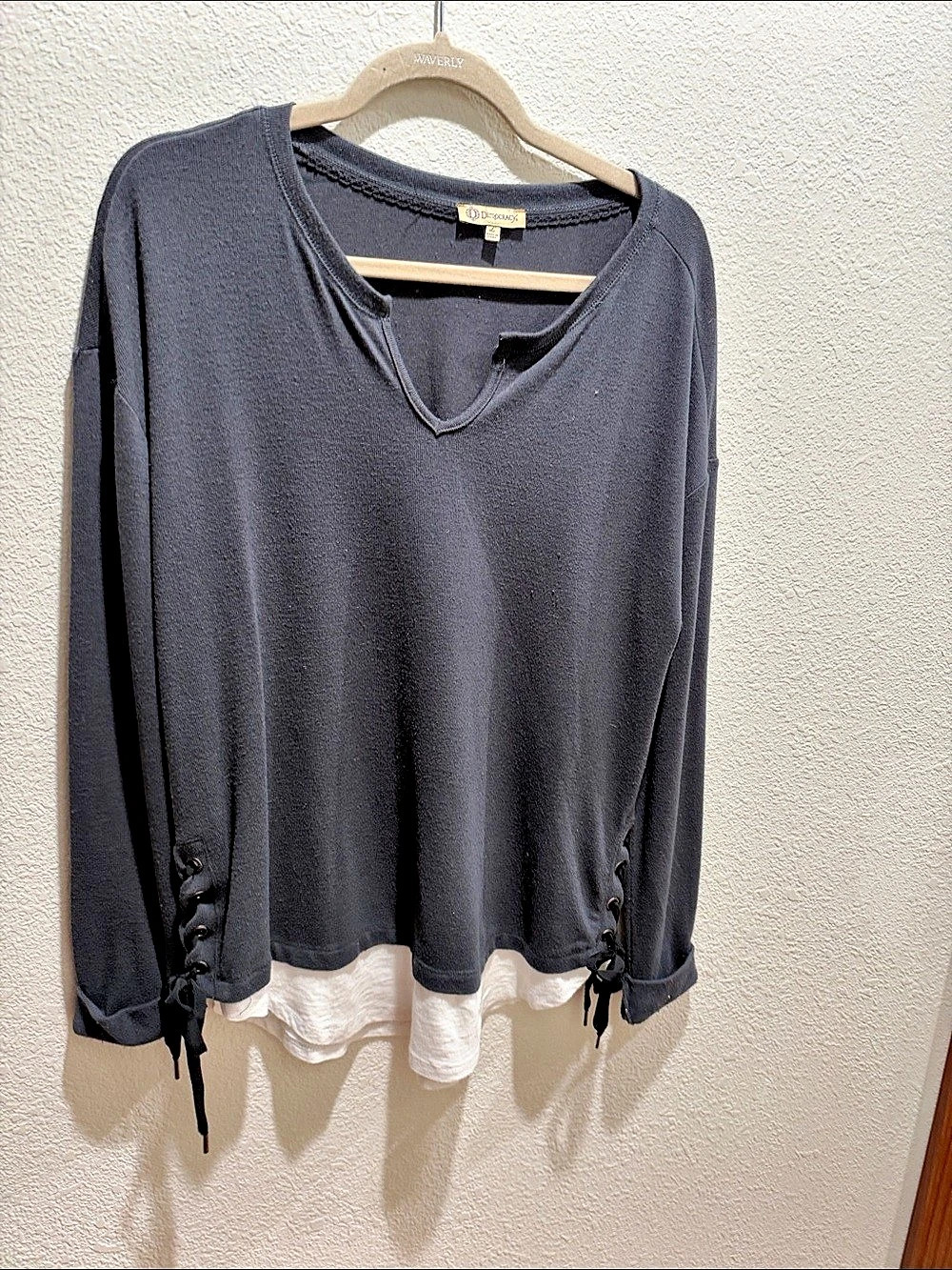 Layered Hem Long Sleeve Top in Black and White hem with side side lace ups.